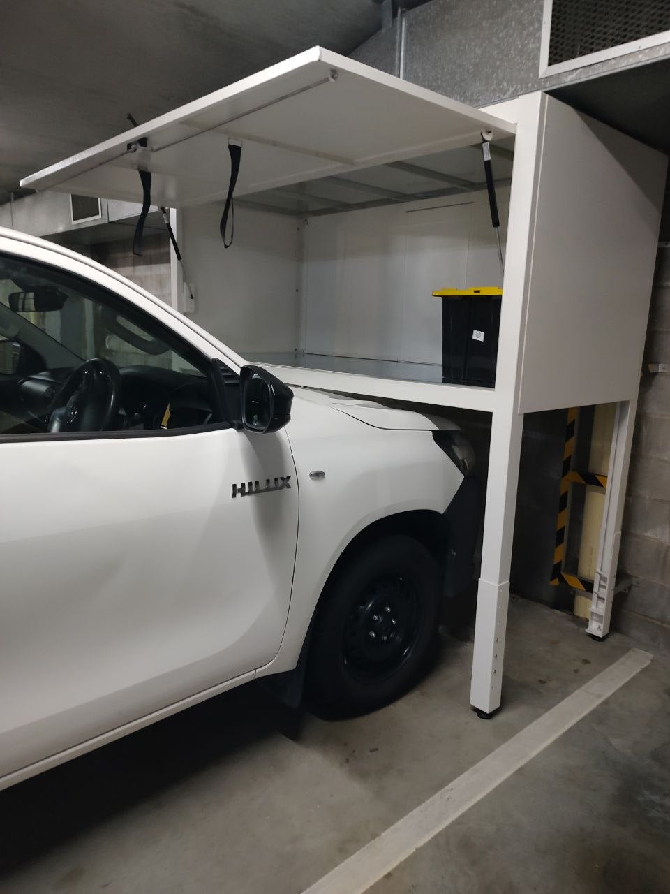 BonnetVault lockable over bonnet storage cabinet with gas struts and spacious interior.